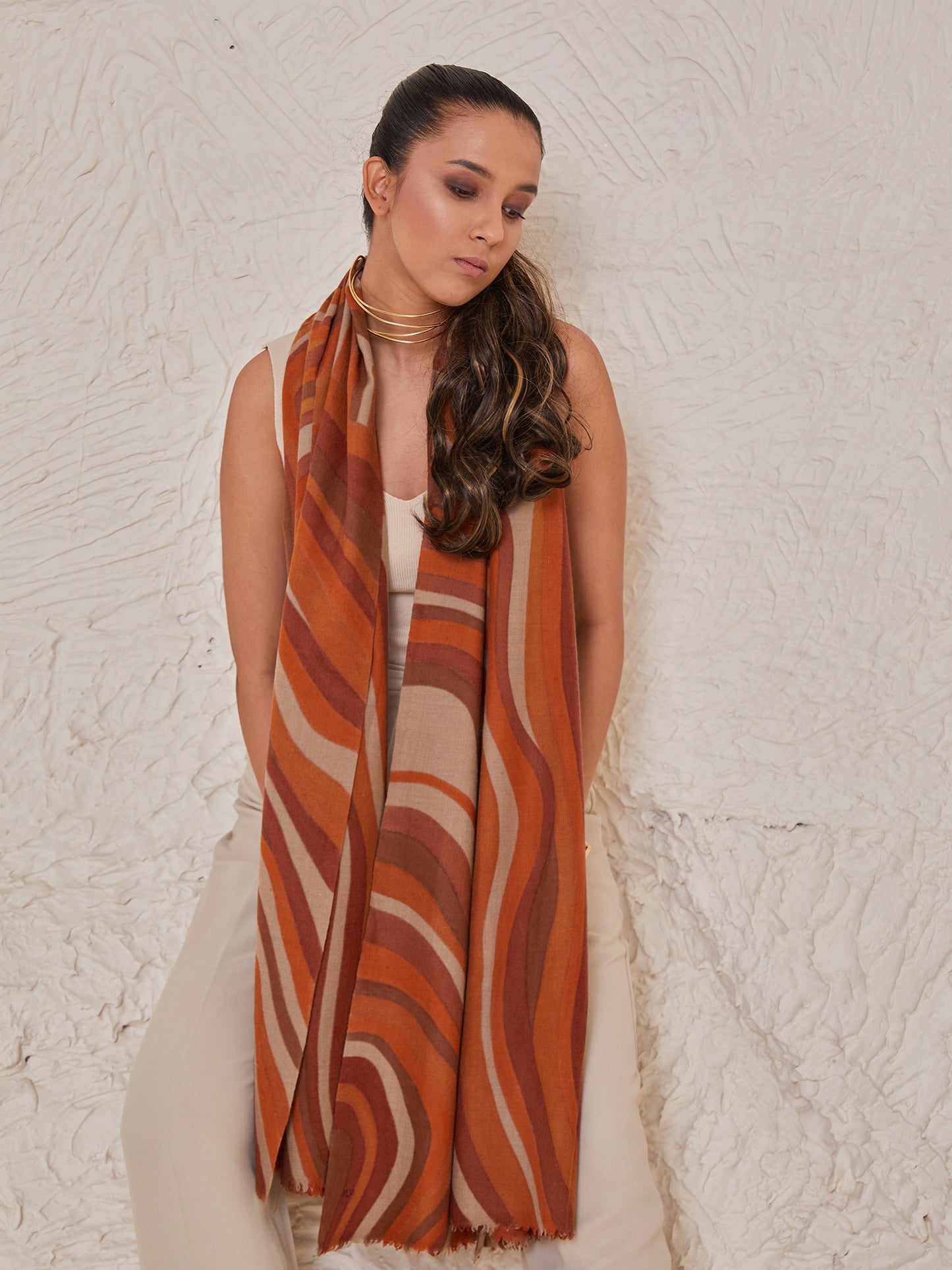 Model is wearing the disruption pashmina stole from shaza, handpainted in colours of brown symbolizing space.