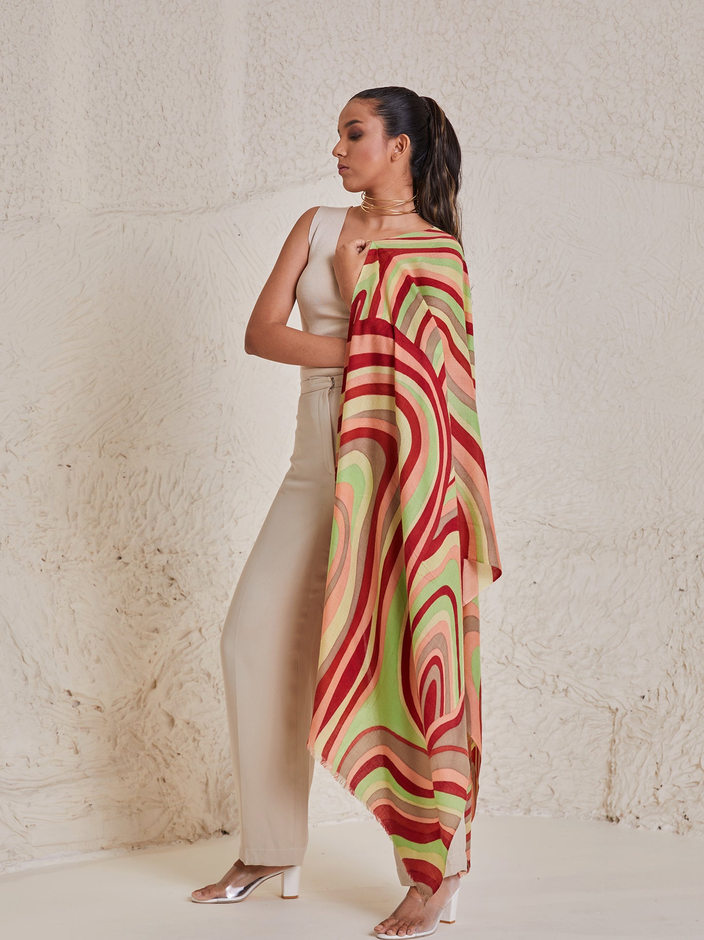 Model is wearing the disruption pashmina stole from shaza, handpainted in colours of green and red symbolizing symphony.