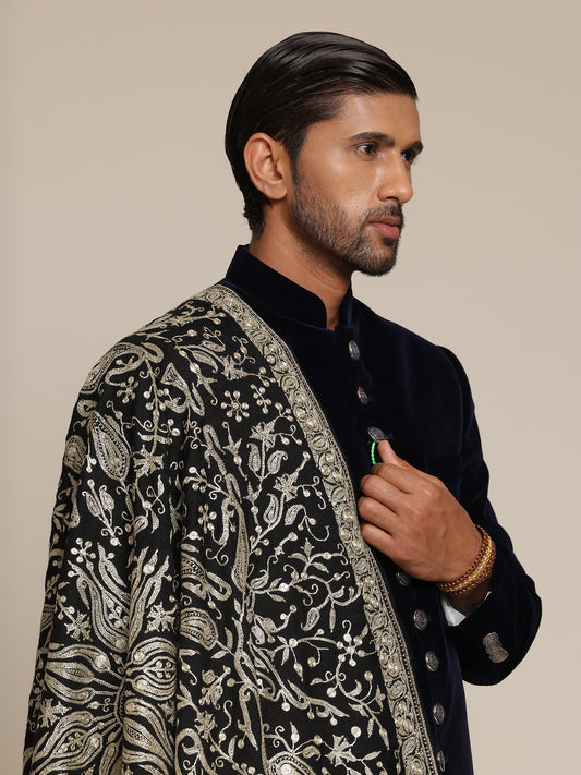 Man wearing a black pashmina shawl