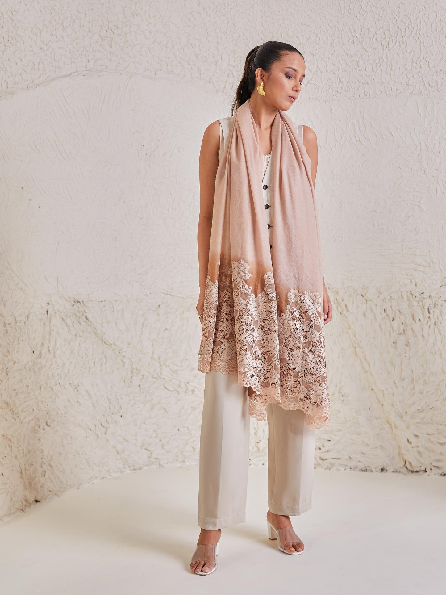Model is wearing the Celestial Chantilly Pashmina Stole from shaza in gold-brown ombre..