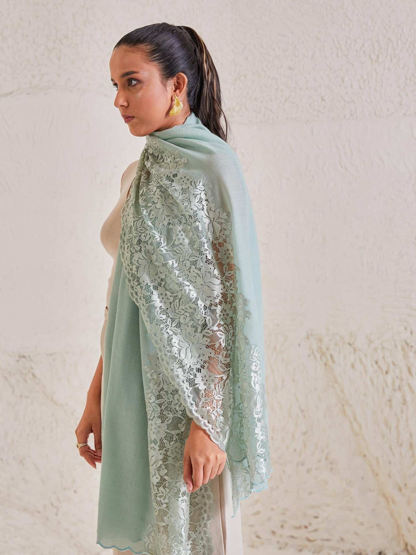 Model is wearing the Celestial Chantilly Pashmina Stole from shaza in sea green..