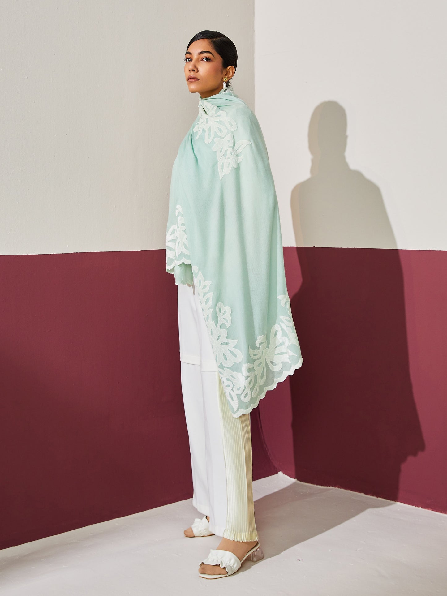 Model is wearing a mint Velvet affair cashmere stole with white applique from Shaza.