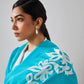 Model is wearing a firozi blue Velvet affair cashmere stole with white applique from Shaza.