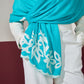 Model is wearing a firozi blue Velvet affair cashmere stole with white applique from Shaza.