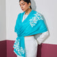 Model is wearing a firozi blue Velvet affair cashmere stole with white applique from Shaza.