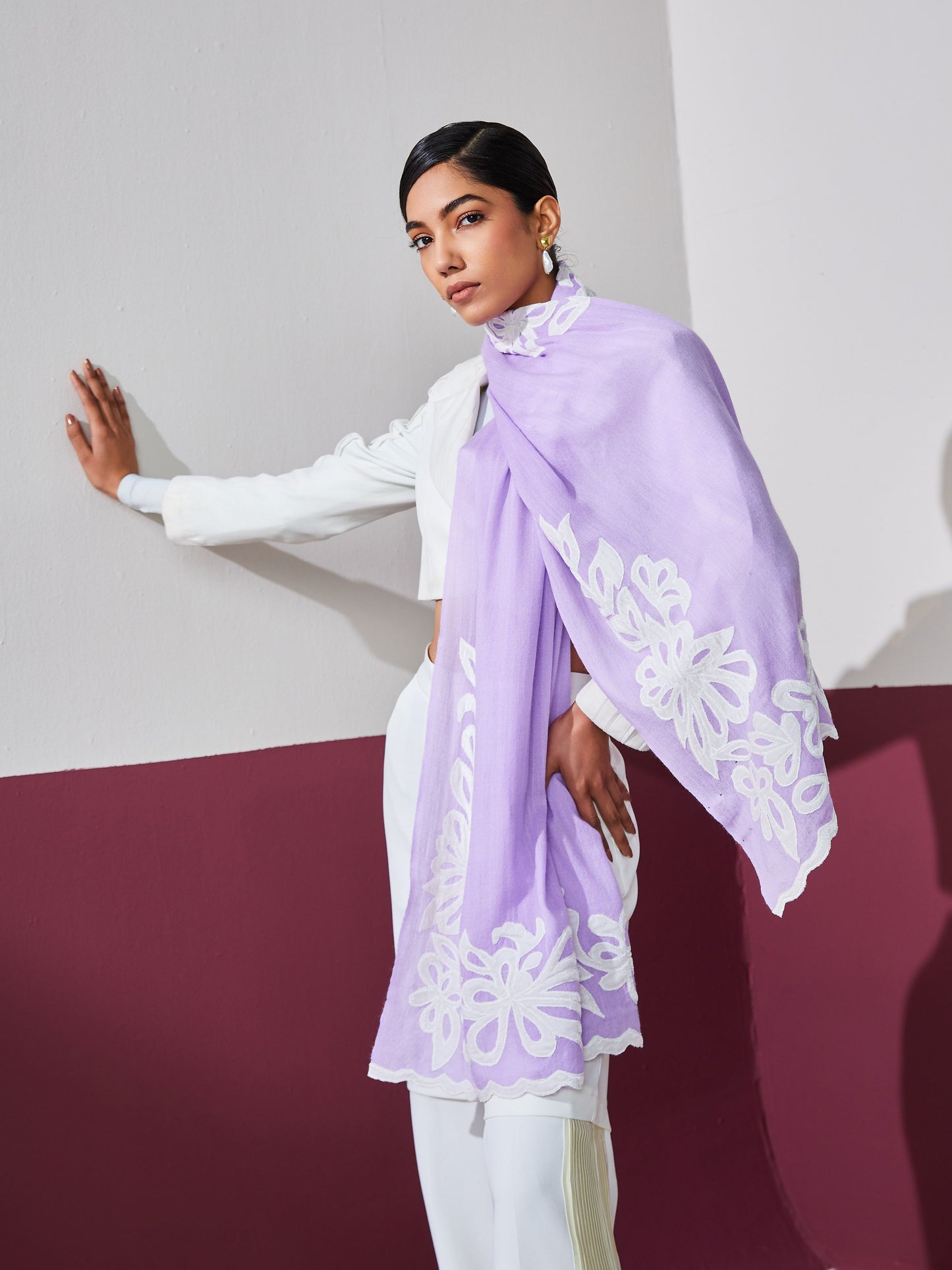 Model is wearing a lavender Velvet affair cashmere stole with white applique from Shaza.