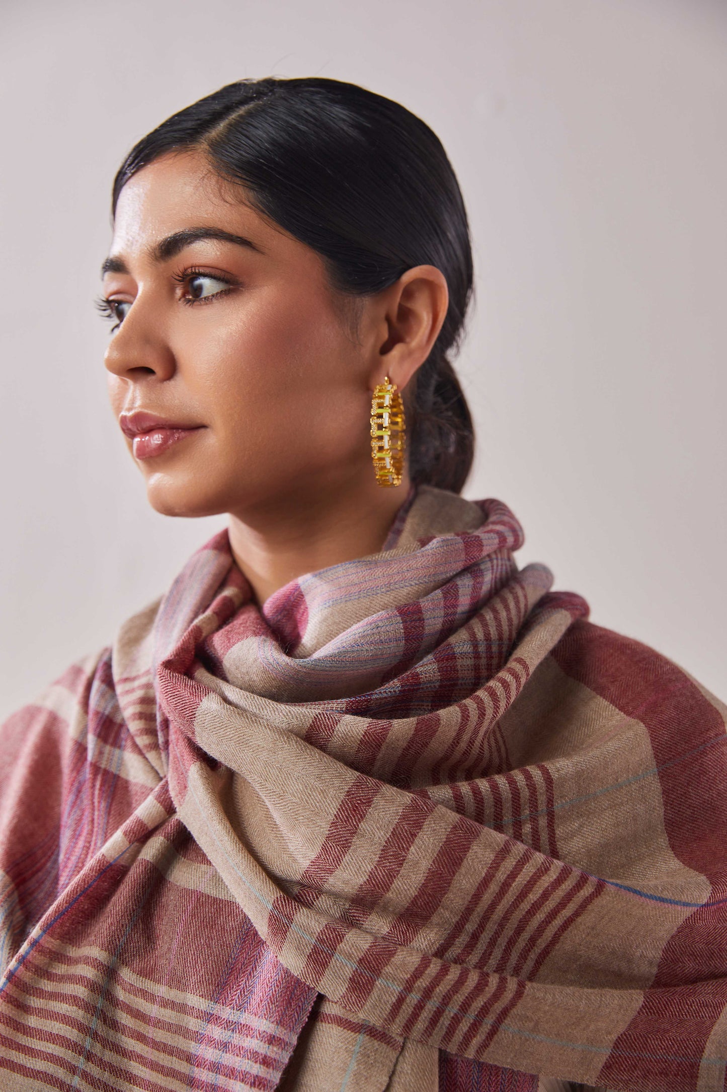Model is wearing a pashmina striped stole from Shaza.