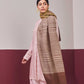 Model is wearing an Ekkat reversible stole in cedar brown from Shaza.