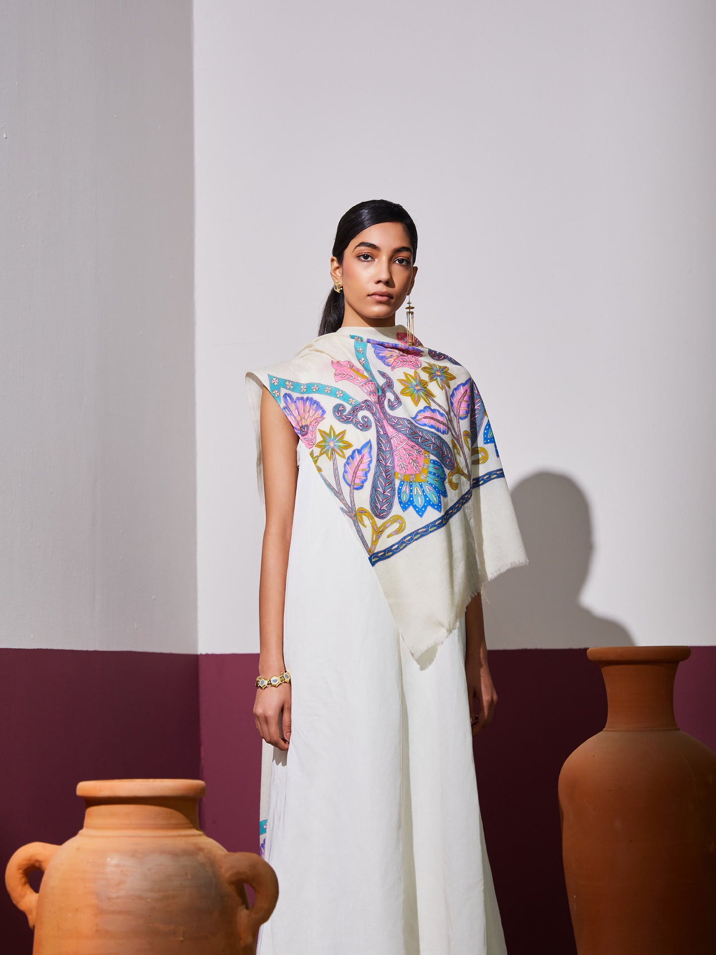 Model is wearing a Pashmina Kalamkari border stole in white from Shaza.