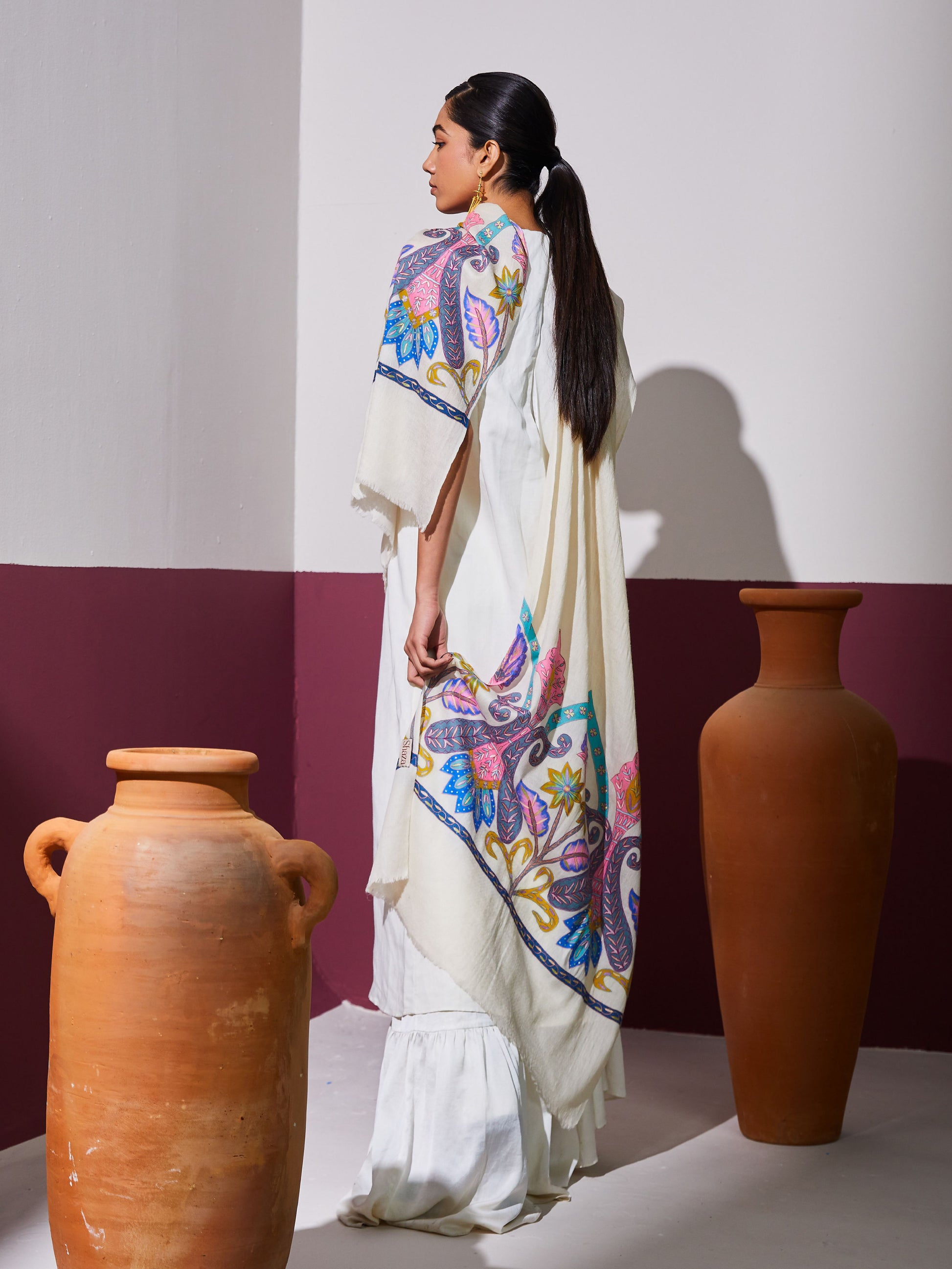 Model is wearing a Pashmina Kalamkari border stole in white from Shaza.