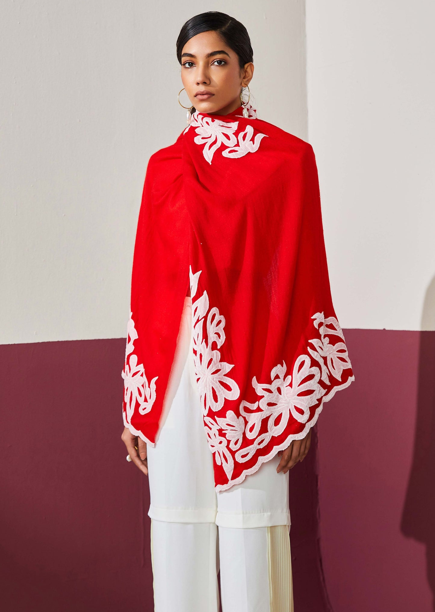 Model is wearing Velvet affair in red with white applique from Shaza.