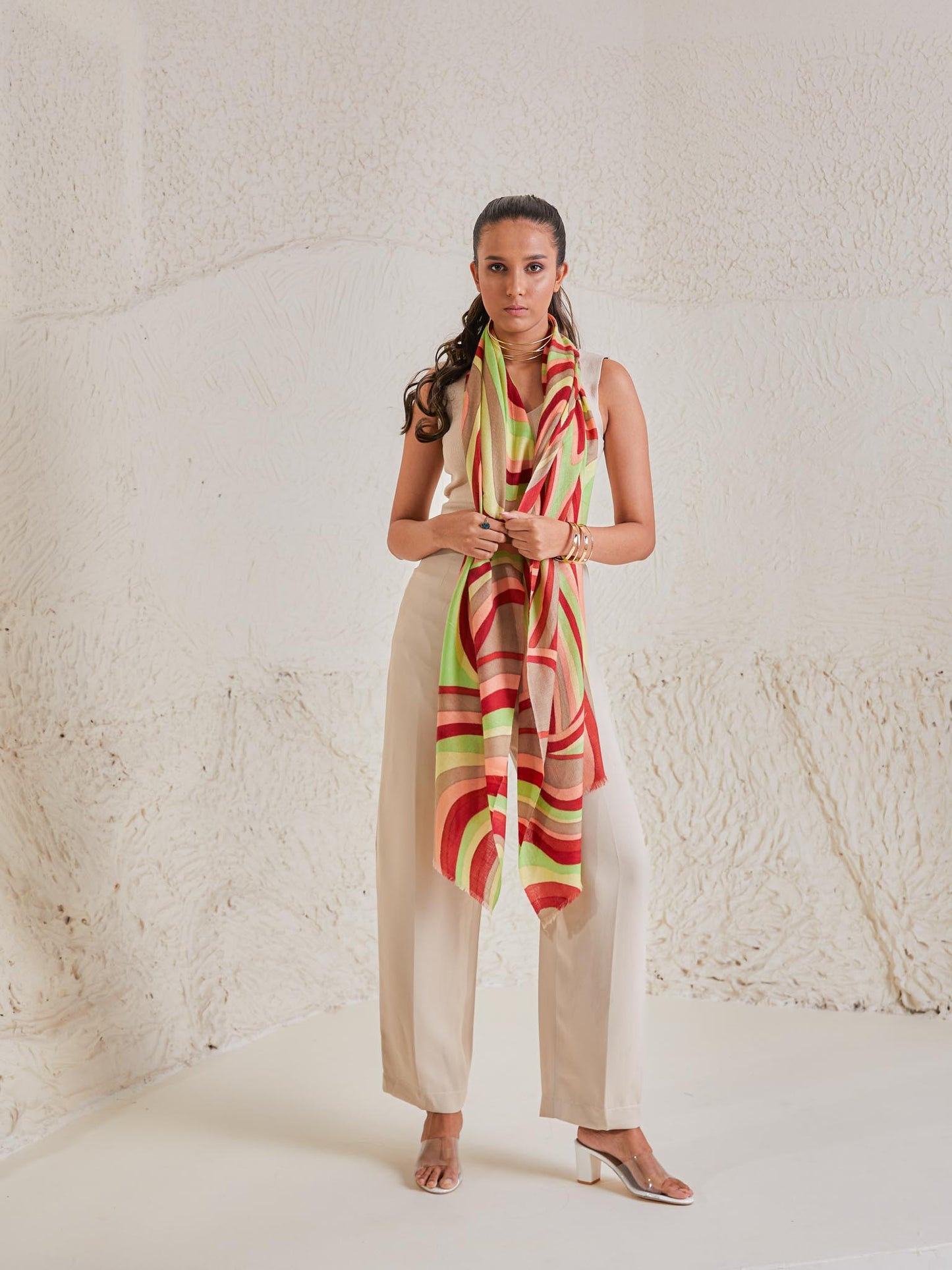 Model is wearing the disruption pashmina stole from shaza, handpainted in colours of green and red symbolizing symphony.