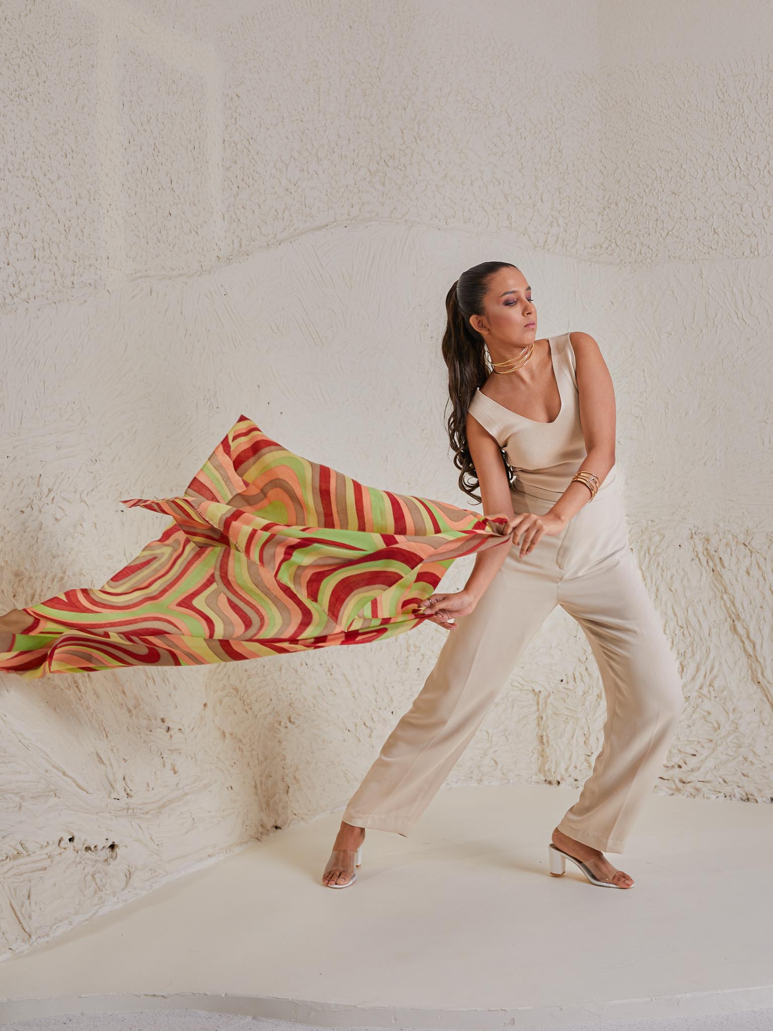 Model is wearing the disruption pashmina stole from shaza, handpainted in colours of green and red symbolizing  symphony.