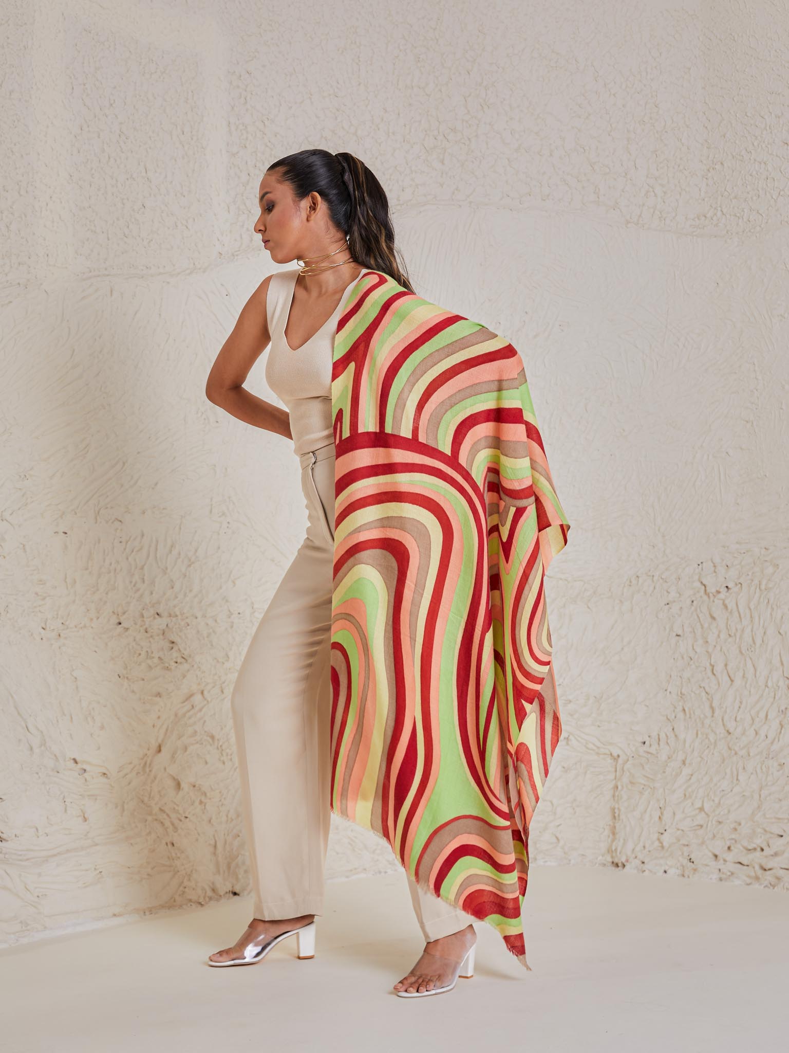 Model is wearing the disruption pashmina stole from shaza, handpainted in colours of green and red symbolizing  symphony.