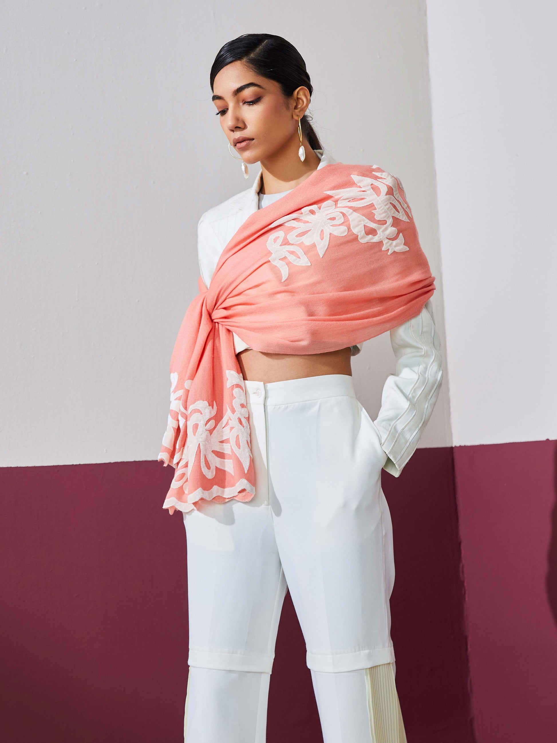 Model is wearing a baby pink Velvet affair cashmere stole with white applique from Shaza.