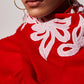 Model is wearing Velvet affair in red with white applique from Shaza.