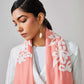 Model is wearing a baby pink Velvet affair cashmere stole with white applique from Shaza.