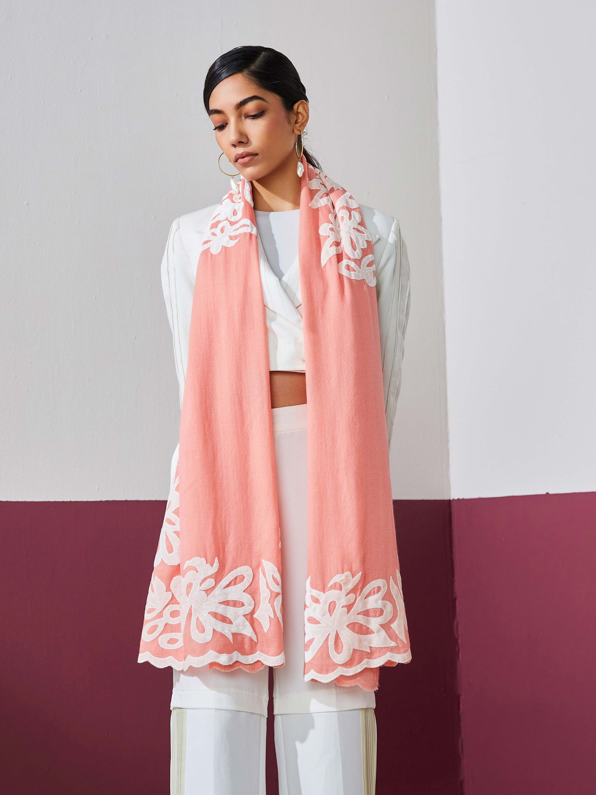 Model is wearing a baby pink Velvet affair cashmere stole with white applique from Shaza.