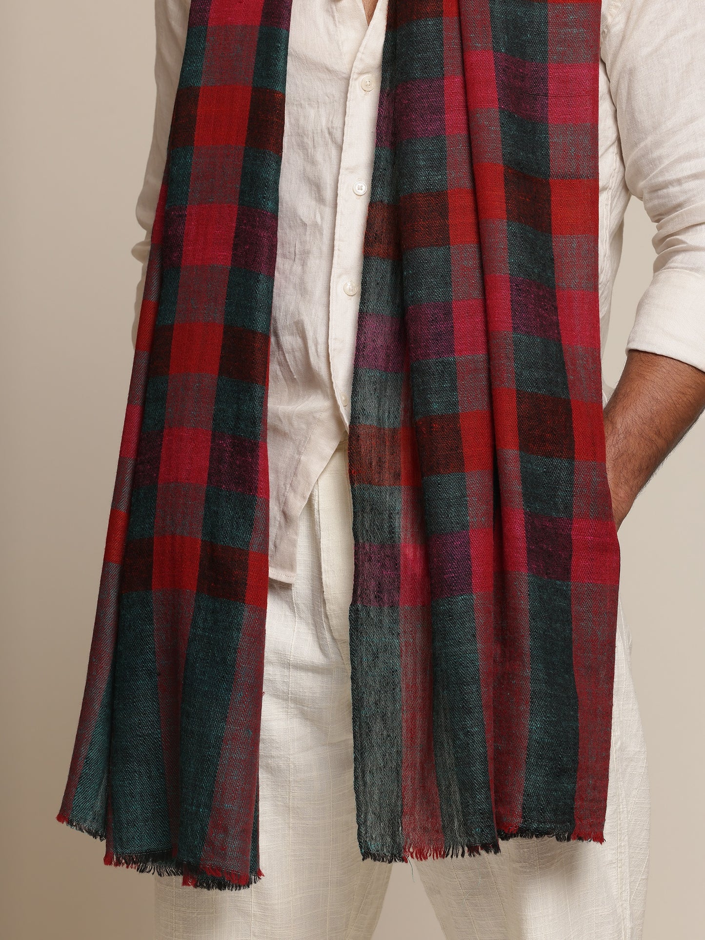 Man wearing a red pashmina check stole