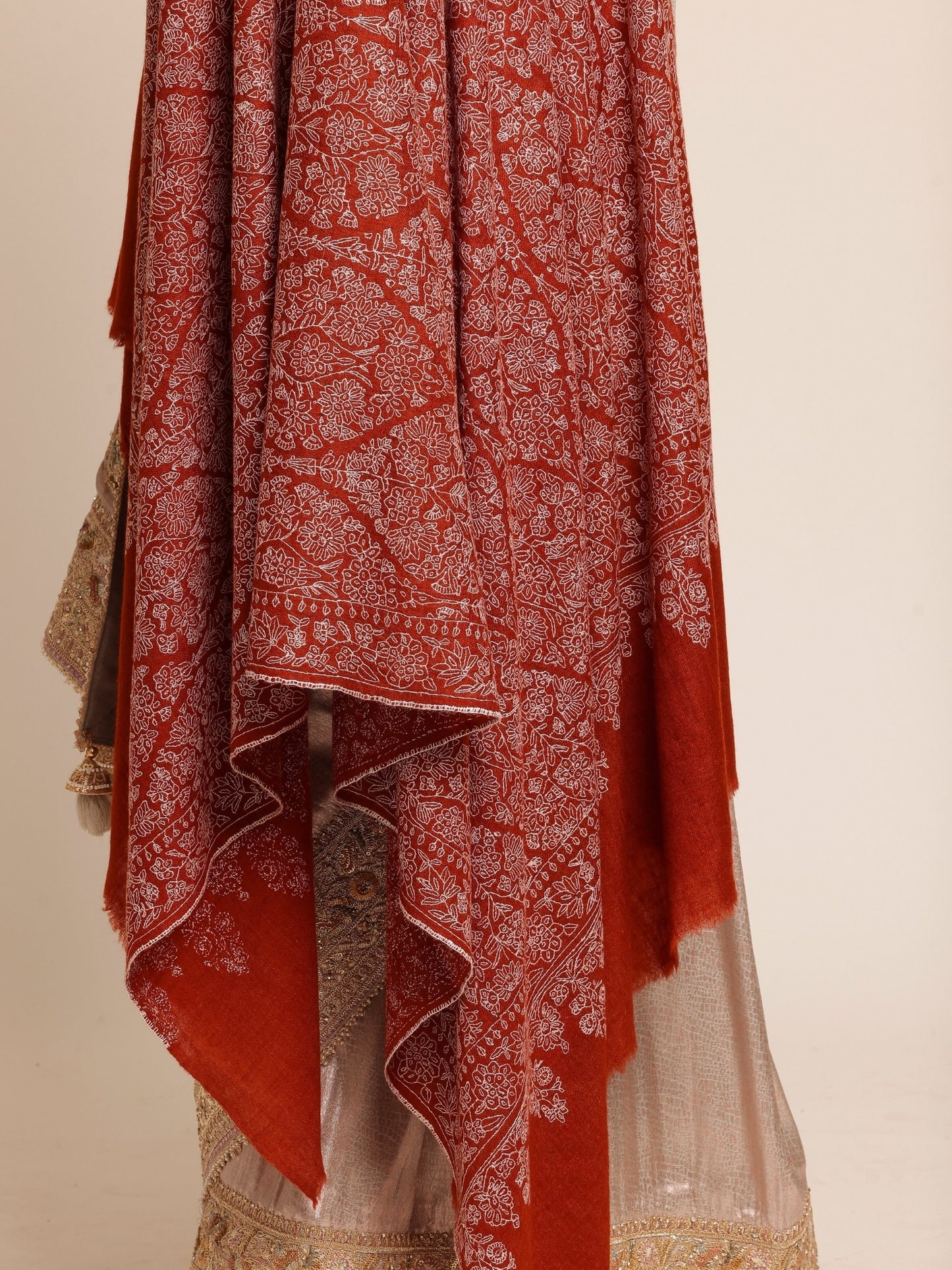 Woman wearing a rust brown pashmina shawl