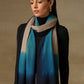 Model is wearing a Saya Ombre stole from Shaza, in the colour Deep Sea: Toosh, gemstone blue and prussian blue. 