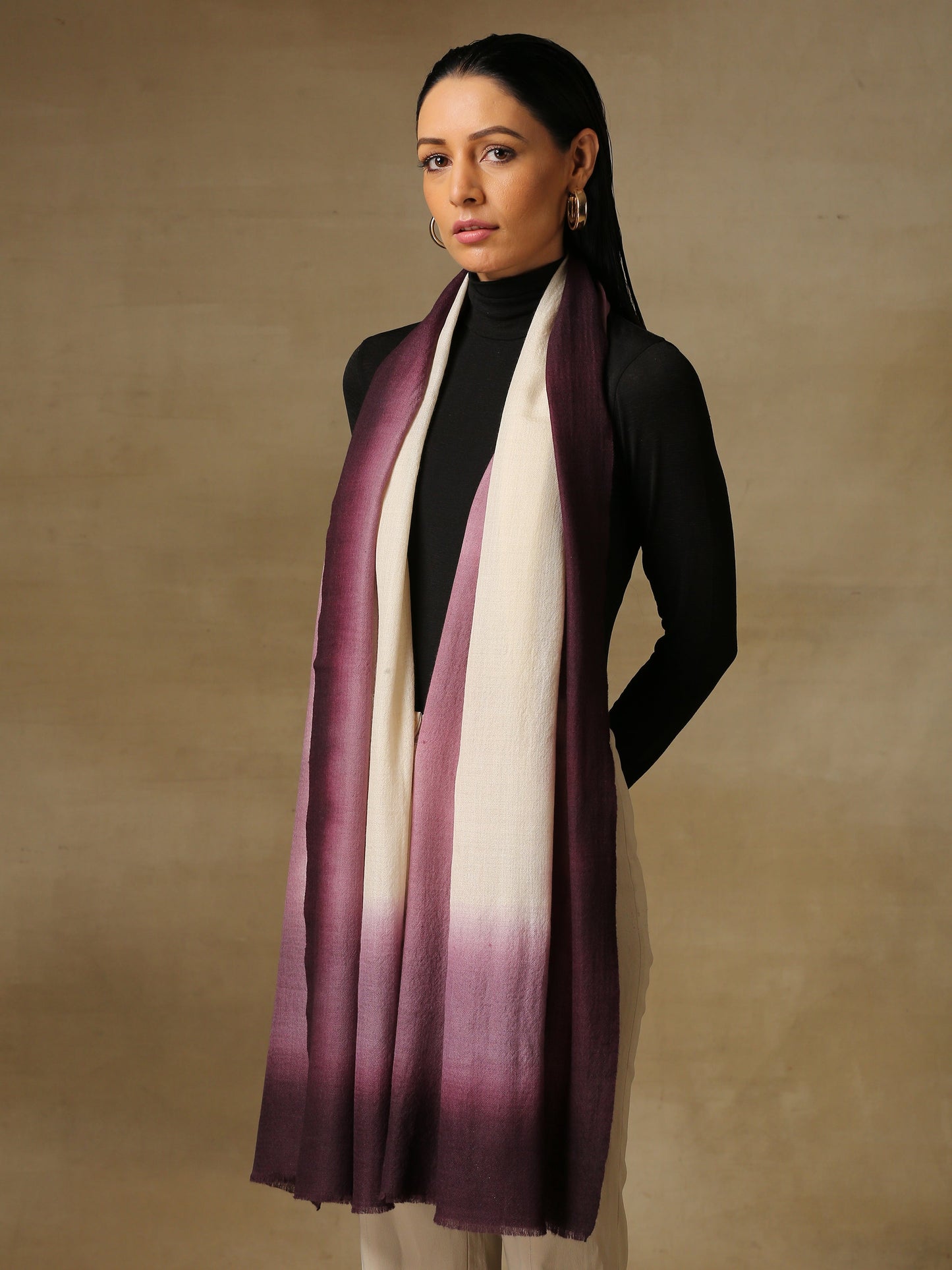 Model is wearing a Saya Ombre stole from Shaza, in the colour Orchid: White and an ombre of light and dark purple.