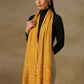 Model is wearing a Shellwork stole from shaza with hand embellished shellwork, in the colour mustard.. 