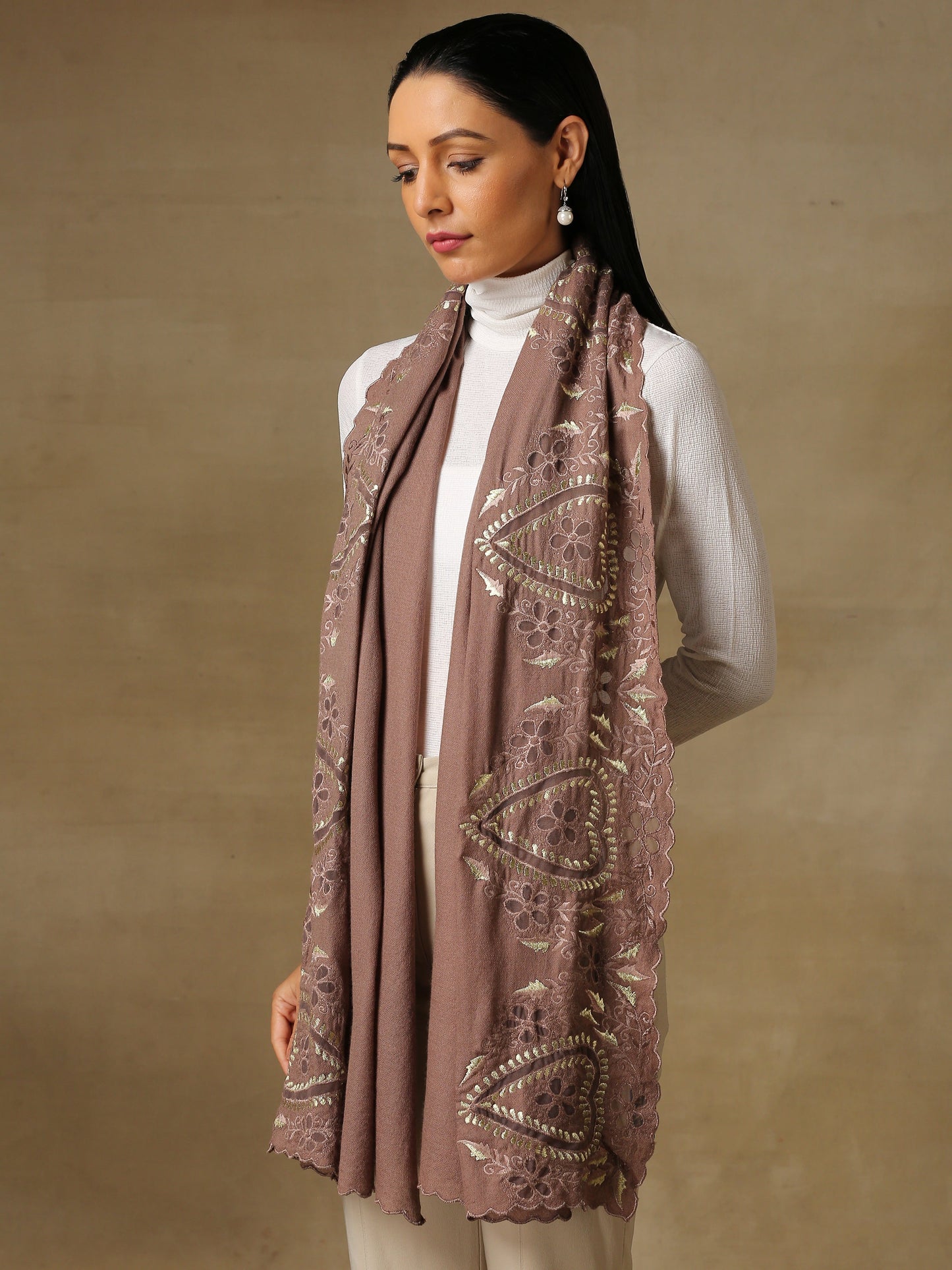 Model is wearing a Vineyard stole in the colour mauve, featuring vine shaped cutwork and zari detailing.