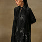 Model is wearing a Vineyard Zaywar stole featuring cutwork vine pattern bordered with zari details and hand embellished with fine swarovski, in a black colour.