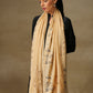 Model is wearing a Vineyard Zaywar stole featuring cutwork vine pattern bordered with zari details and hand embellished with fine swarovski, in a light yellowcolour.