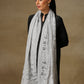 Model is wearing a Vineyard Zaywar stole featuring cutwork vine pattern bordered with zari details and hand embellished with fine swarovski, in a ice blue colour.