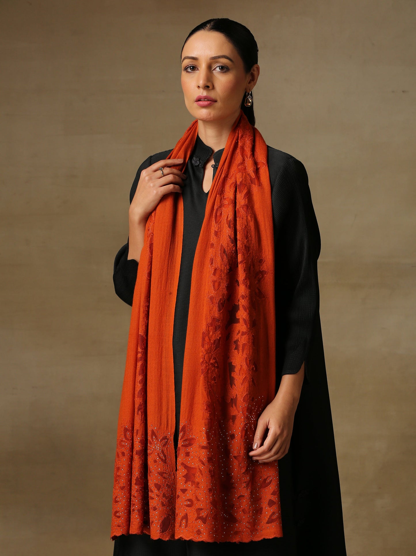 Model is wearing Cutwork Zaywar stole from Shaza in orange.