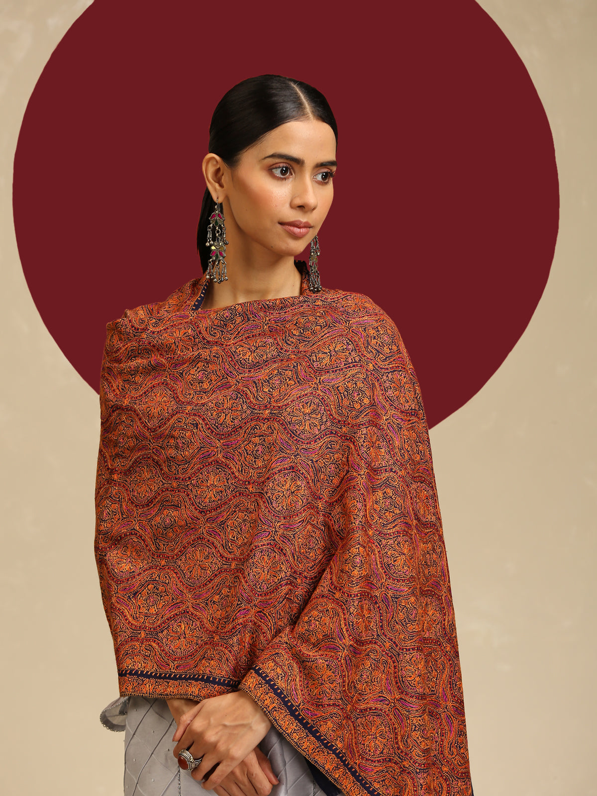 Model is wearing a thread embroidery jaama stole in a midnight blue colour with delicate threadwork needle embroidery all over.