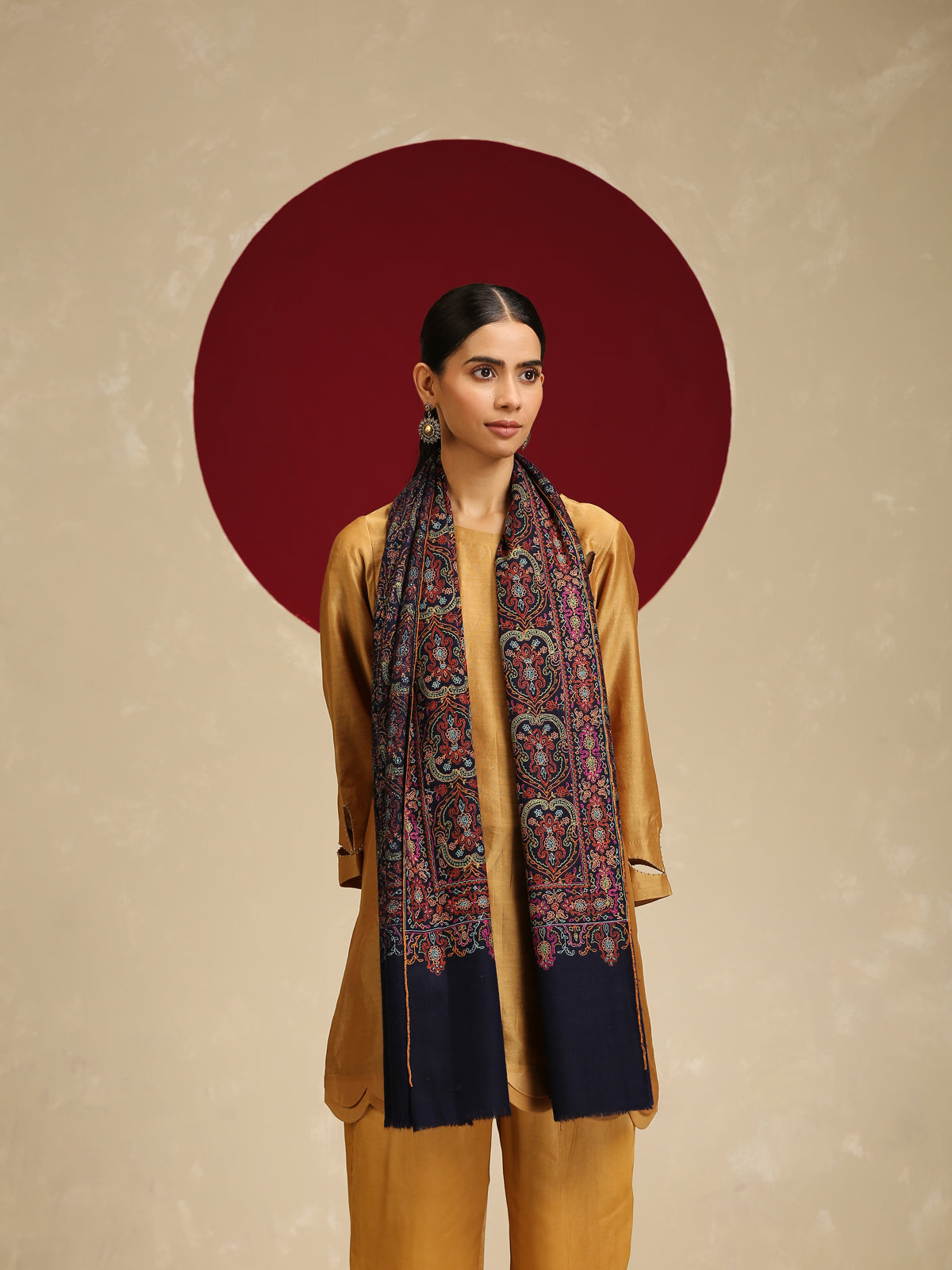Model is wearing a Needlework pashmina shawl from shaza in midnight blue.