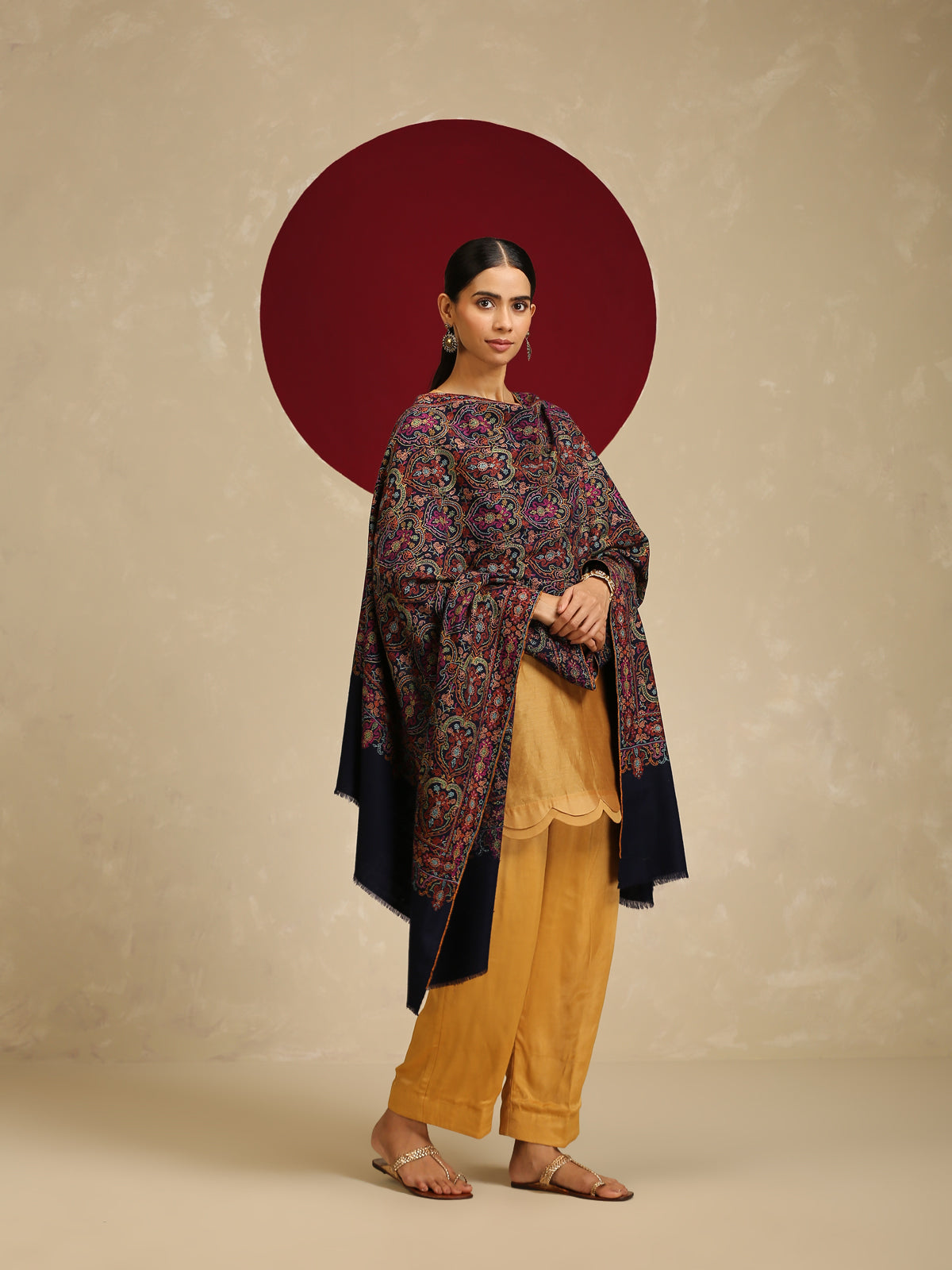 Model is wearing a Needlework pashmina shawl from shaza in midnight blue.