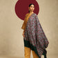 Model is wearing a Needlework pashmina shawl from shaza in a green colour.
