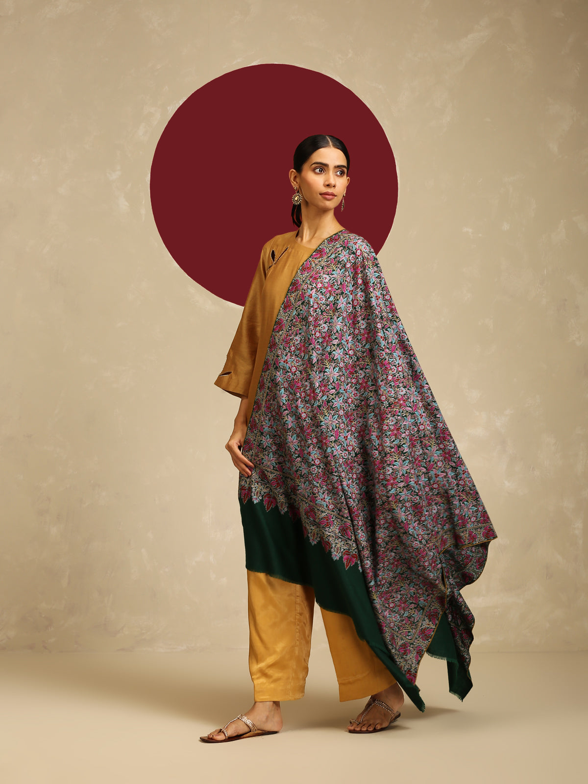 Model is wearing a Needlework pashmina shawl from shaza in a green colour.