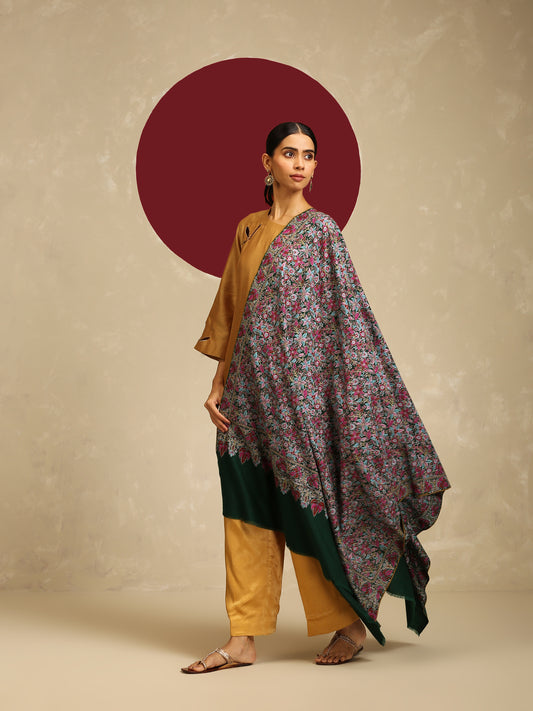 Model is wearing a Needlework pashmina shawl from shaza in a green colour.