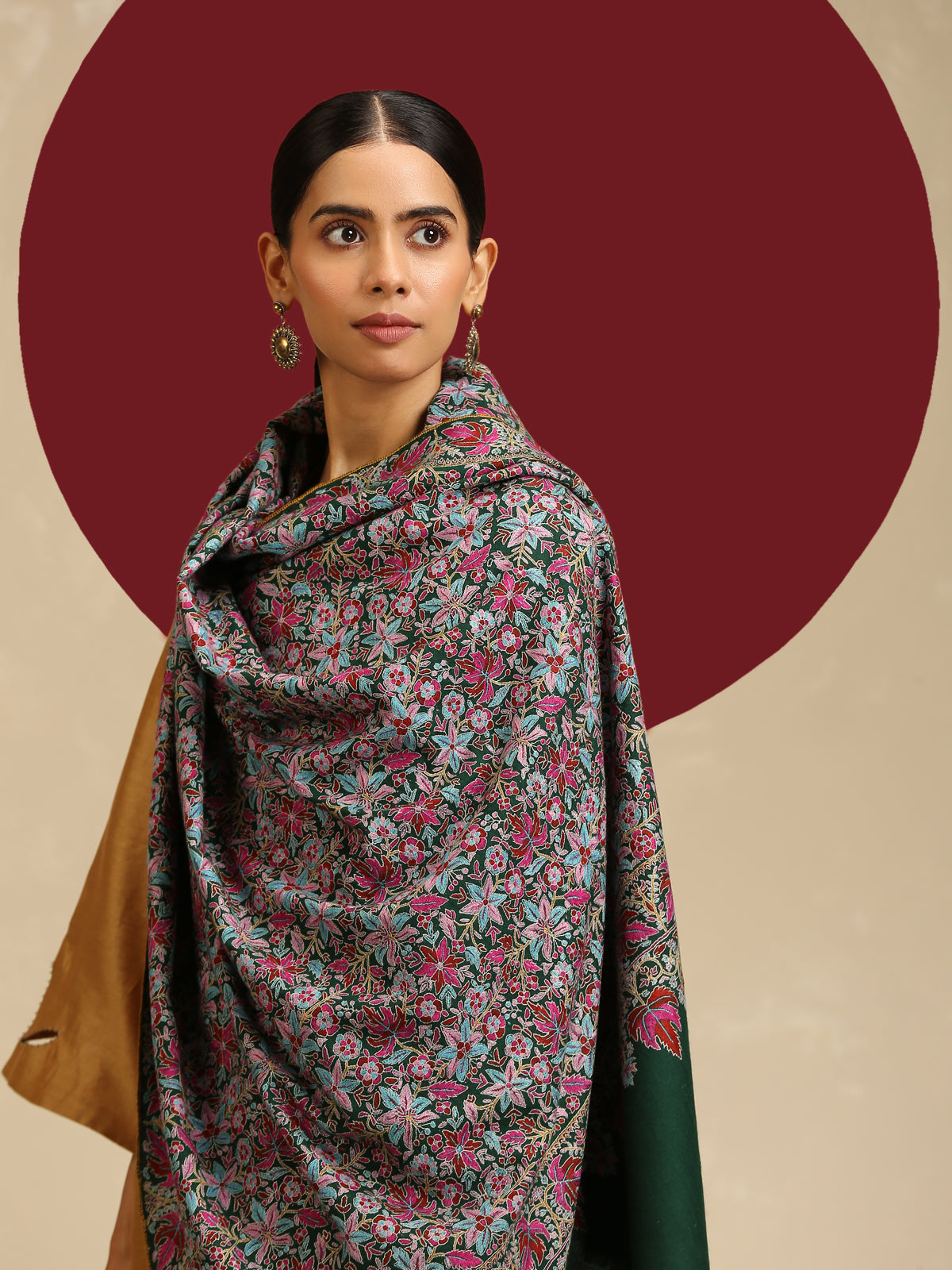 Model is wearing a Needlework pashmina shawl from shaza in a green colour.