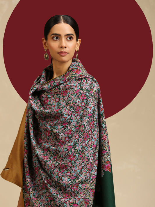 Model is wearing a Needlework pashmina shawl from shaza in a green colour.