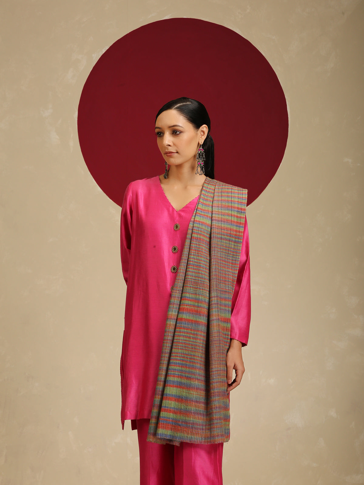 Model is wearing a Pashmina Striped stole from Shaza with multicoloured lines on a brown base.