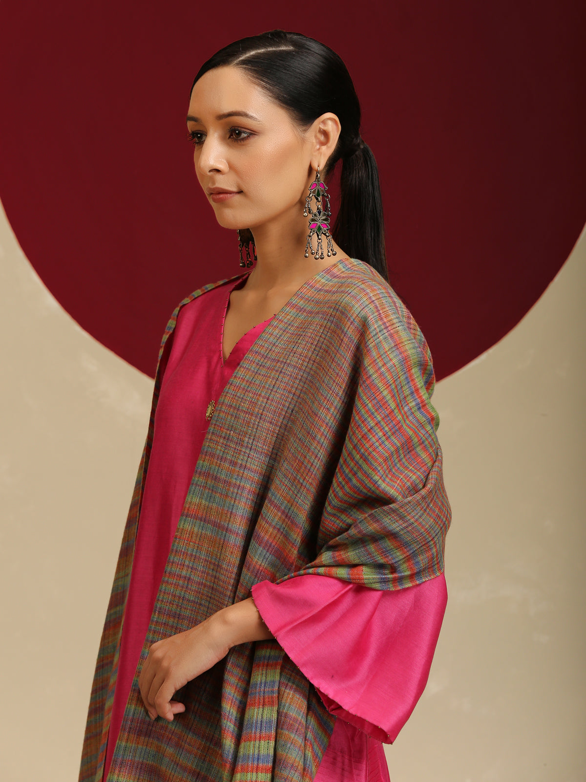 Model is wearing a Pashmina Striped stole from Shaza with multicoloured lines on a brown base.
