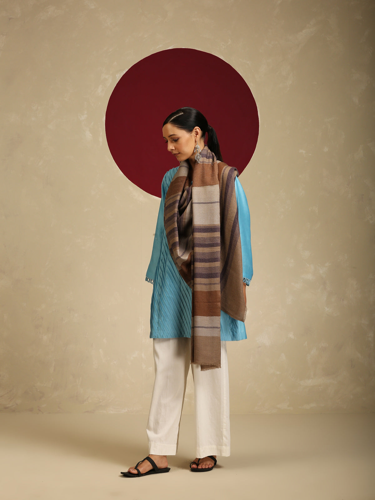 Model is wearing Pashmina check stole in brown and purple stripes.