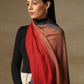 Model is wearing a Pashmina Ombre stole in self weave in the colours crimson orange & blue. 