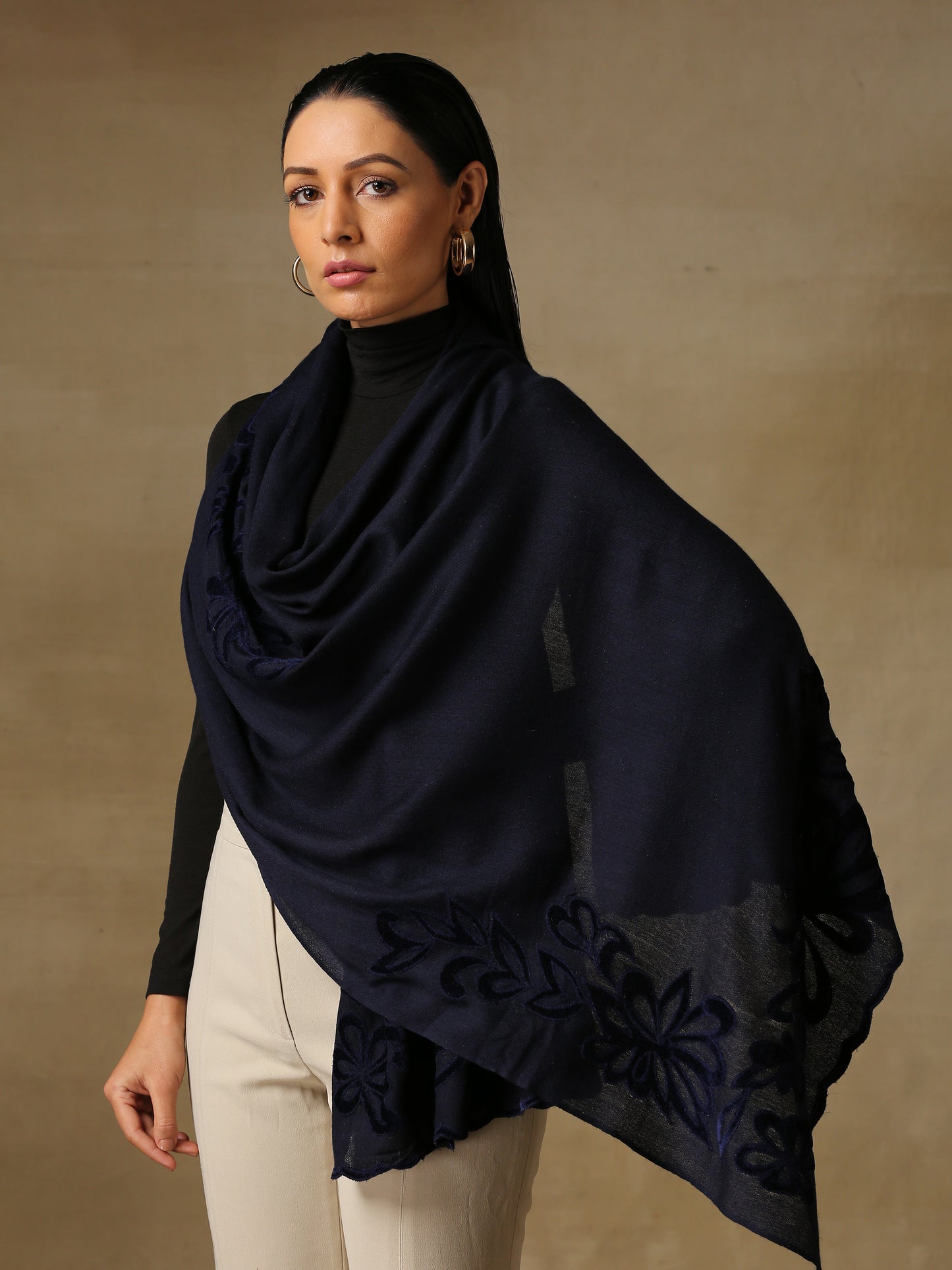 Model is wearing a Velvet Affair stole from Shaza featuring navy blue velvet applique on a navy blue coloured cashmere stole.