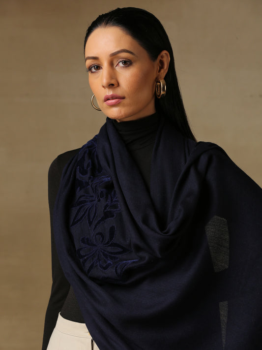 Model is wearing a Velvet Affair stole from Shaza featuring navy blue velvet applique on a navy blue coloured cashmere stole. 