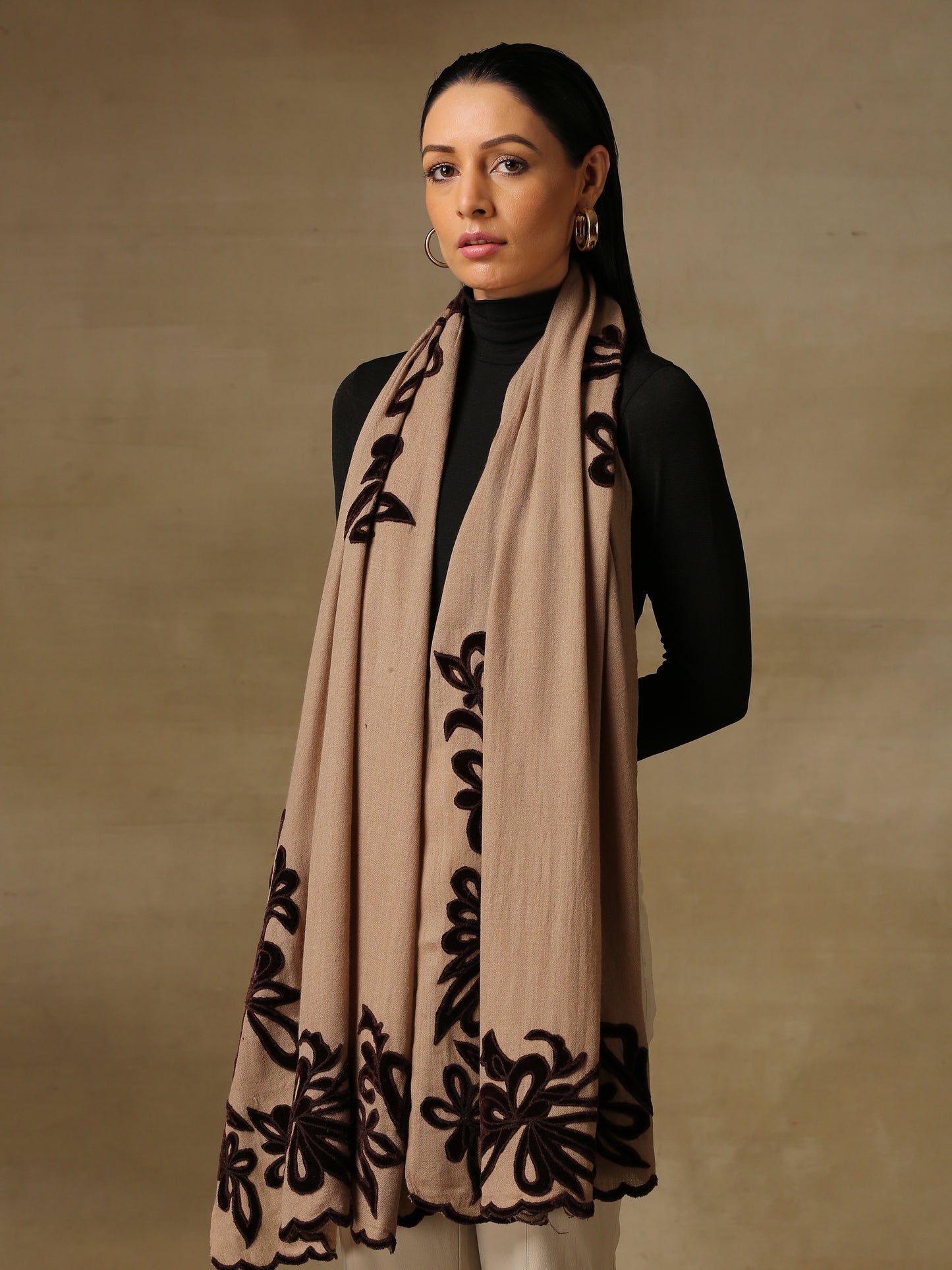 Model is wearing a Velvet Affair stole from Shaza featuring brown velvet applique on a toosh coloured cashmere stole.