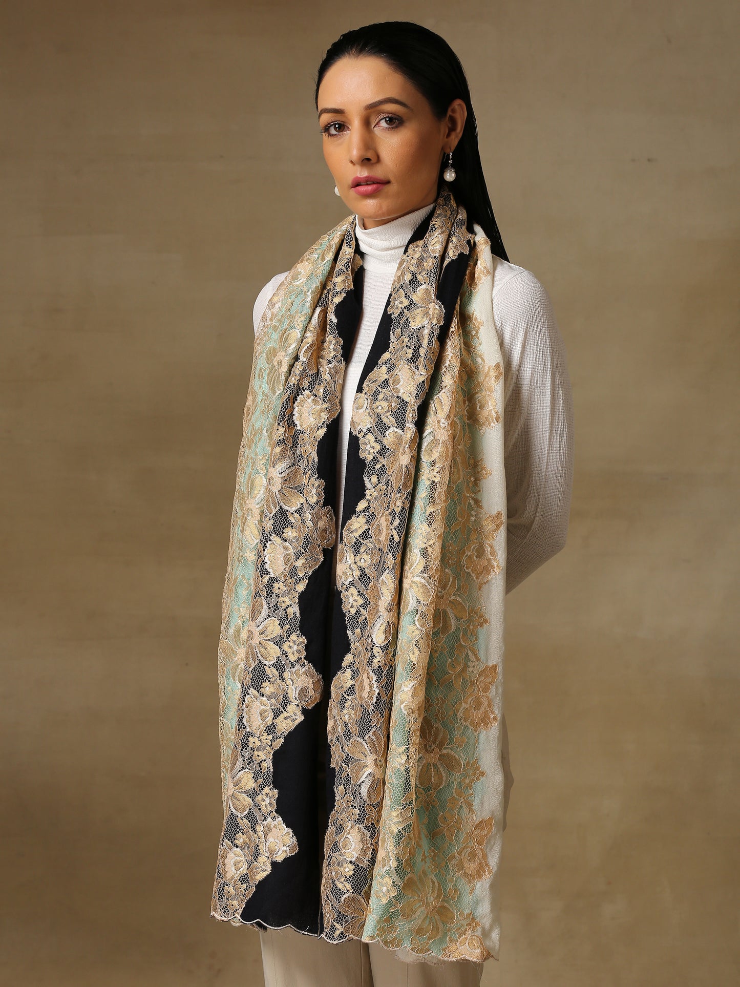 Model is wearing Celestial Chantilly stole from Shaza in ombre of white, black and blue.