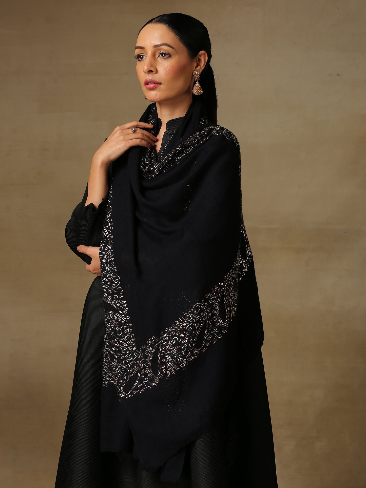 Model is wearing black stole from the Era of Zaywar Border Swarovski Stole collection, hand embellished with fine swarovski in paisley design , along the border.