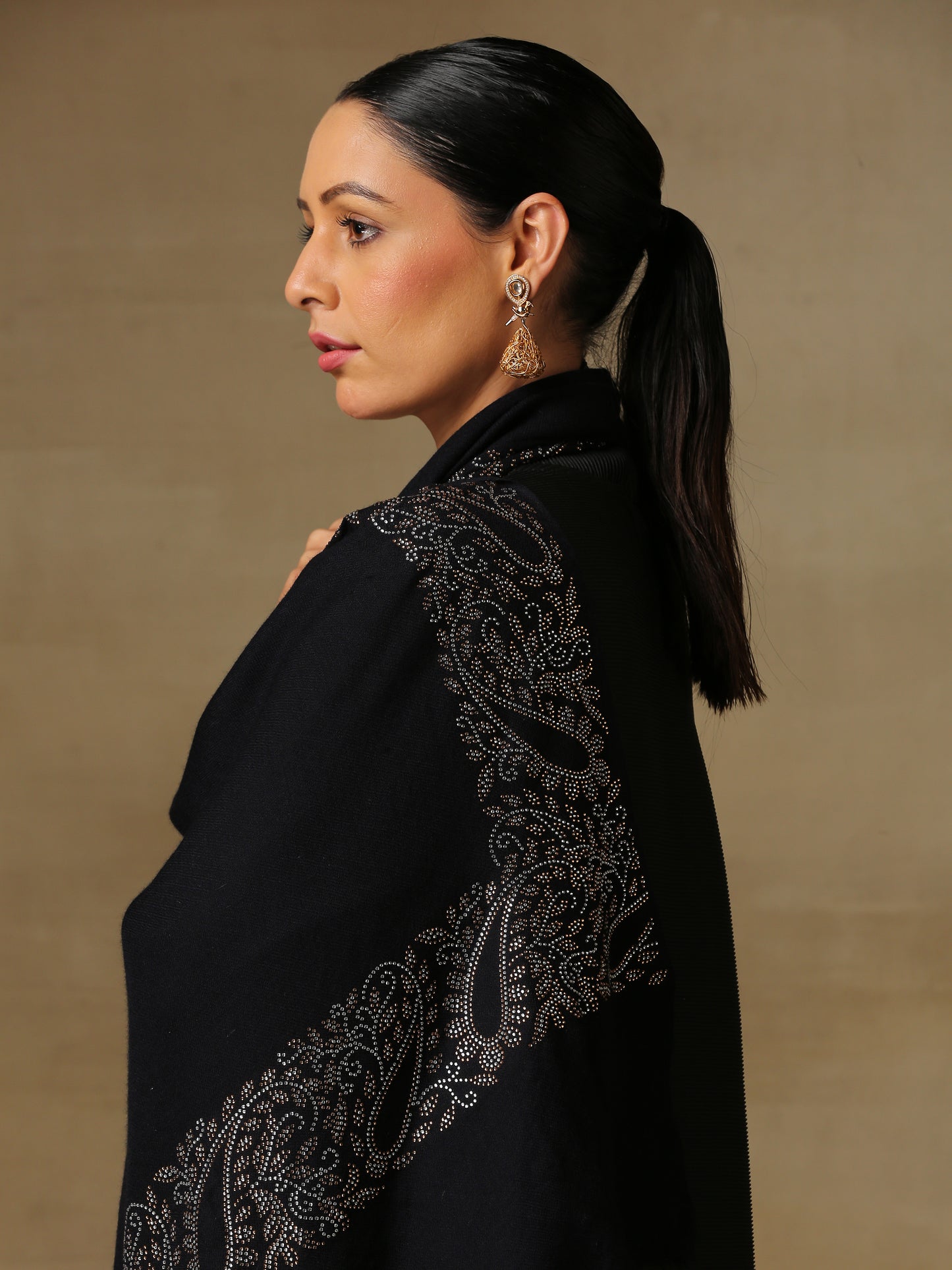 Model is wearing black stole from the Era of Zaywar Border Swarovski Stole collection, hand embellished with fine swarovski in paisley design , along the border.